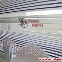 renk-skalasi-pliseli-zebra-perde-mor-boncuklu